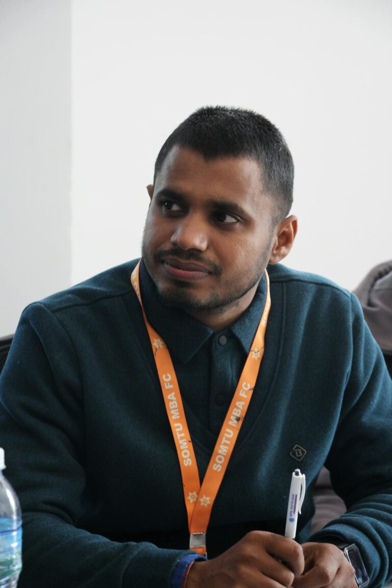 University student attentively listening during an academic seminar session.